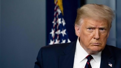 (FILES) US President Donald Trump arrives to speak at the press briefing at the White House in Washington, DC, on July 30, 2020. Donald Trump said he will turn himself in on August 24, 2023 in Georgia to face racketeering and other charges stemming from his bid to overturn the 2020 election. (Photo by JIM WATSON / AFP) (AFP)