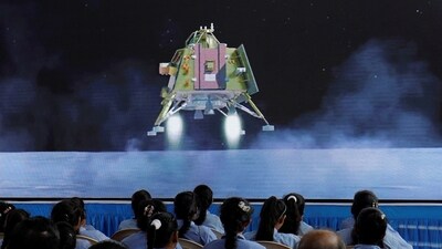 People watch a live stream of Chandrayaan-3 spacecraft's landing on the moon, inside an auditorium of Gujarat Science City in Ahmedabad. (REUTERS)