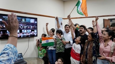 Indians celebrate the successful landing of Chandrayaan-3 at the Nehru Planetarium in New Delhi. (AP) Indians celebrate the successful landing of Chandrayaan-3 at the Nehru Planetarium in New Delhi. (AP)