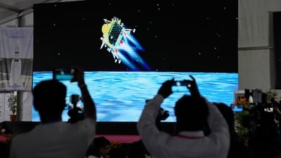 Journalists film the live telecast of spacecraft Chandrayaan-3 landing on the moon at ISRO's Telemetry, Tracking and Command Network facility in Bengaluru. The Chandrayaan-3 is expected to remain functional for two weeks, running a series of experiments including a spectrometer analysis of the mineral composition of the lunar surface. (AP) Journalists film the live telecast of spacecraft Chandrayaan-3 landing on the moon at ISRO's Telemetry, Tracking and Command Network facility in Bengaluru. The Chandrayaan-3 is expected to remain functional for two weeks, running a series of experiments including a spectrometer analysis of the mineral composition of the lunar surface. (AP)