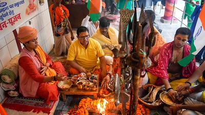 Mahant of Sri Mankameshwar temple Mahant Devaigya Puri performs 'puja' and 'havan' for the safe landing of Chandrayaan -3, in Lucknow. (PTI) Mahant of Sri Mankameshwar temple Mahant Devaigya Puri performs 'puja' and 'havan' for the safe landing of Chandrayaan -3, in Lucknow. (PTI)