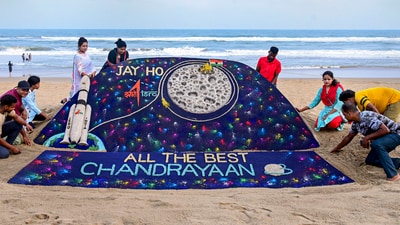 Students of Sudarsan Sand Art Institute create a sand art on ISRO's lunar mission Chandrayaan-3 at the beach in Puri. (PTI) Students of Sudarsan Sand Art Institute create a sand art on ISRO's lunar mission Chandrayaan-3 at the beach in Puri. (PTI)