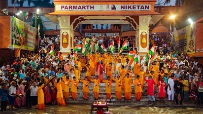 Monks offer prayers during a Ganga Aarti ahead of the crowning moment of India’s third lunar mission, in Rishikesh. (PTI) Monks offer prayers during a Ganga Aarti ahead of the crowning moment of India’s third lunar mission, in Rishikesh. (PTI)