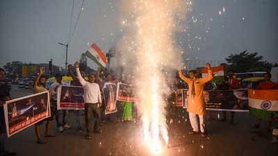People celebrate the successful soft landing of ISRO's lunar mission Chandrayaan-3's Lander Module (LM) on the Moon, in Patna, Wednesday. (PTI) People celebrate the successful soft landing of ISRO's lunar mission Chandrayaan-3's Lander Module (LM) on the Moon, in Patna, Wednesday. (PTI)
