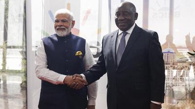 Prime Minister Narendra Modi with South African President Cyril Ramaphosa at the 2023 BRICS Summit in Johannesburg on Wednesday. (AP Photo) Prime Minister Narendra Modi with South African President Cyril Ramaphosa at the 2023 BRICS Summit in Johannesburg on Wednesday. (AP Photo)
