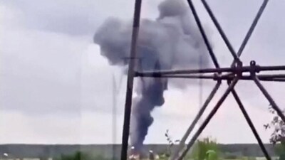 A view shows smoke rising above a plane on fire following an alleged air accident at a location given as Tver region, Russia. (Reuters)