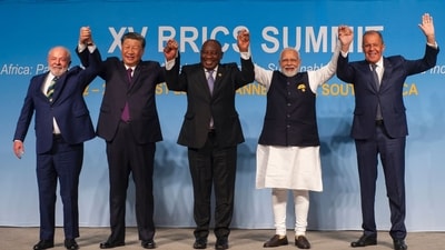 From left: Brazil's President Luiz Inacio Lula da Silva, China's President Xi Jinping, South African President Cyril Ramaphosa, Indian Prime Minister Narendra Modi and Russia's Foreign Minister Sergei Lavrov raise their arms as they pose for a group photograph, at the BRICS Summit in Johannesburg. (AFP) From left: Brazil's President Luiz Inacio Lula da Silva, China's President Xi Jinping, South African President Cyril Ramaphosa, Indian Prime Minister Narendra Modi and Russia's Foreign Minister Sergei Lavrov raise their arms as they pose for a group photograph, at the BRICS Summit in Johannesburg. (AFP)