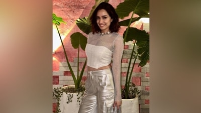 Shraddha accessorised the ensemble with strappy high heels, a choker necklace, and a statement ring. A matching silver mesh bag accentuated the actor's party look. (Instagram) Shraddha accessorised the ensemble with strappy high heels, a choker necklace, and a statement ring. A matching silver mesh bag accentuated the actor's party look. (Instagram)