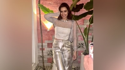 Shraddha wore a corset top featuring a silver see-through mesh overlay and a strapless corset in an ivory shade. The blouse features a round neckline, full-length sleeves, structured boning, a figure-hugging silhouette, an asymmetric hem, and a cropped midriff-baring design. (Instagram) Shraddha wore a corset top featuring a silver see-through mesh overlay and a strapless corset in an ivory shade. The blouse features a round neckline, full-length sleeves, structured boning, a figure-hugging silhouette, an asymmetric hem, and a cropped midriff-baring design. (Instagram)