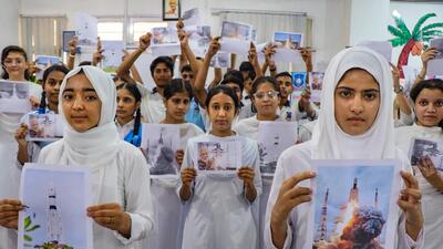 Students in Jammu holding a poster wishing successful landing of Chandrayaan-3. (PTI) Students in Jammu holding a poster wishing successful landing of Chandrayaan-3. (PTI)