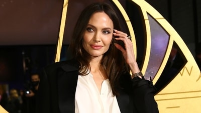 FILE - Angelina Jolie keeps her new tattoo hidden: can you guess what it is? (Photo by Joel C Ryan/Invision/AP, File) (Invision) FILE - Angelina Jolie keeps her new tattoo hidden: can you guess what it is? (Photo by Joel C Ryan/Invision/AP, File) (Invision)