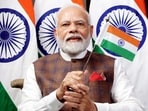 Prime Minister Narendra Modi waves the Indian flag while watching the telecast of Chandrayaan-3's successful soft landing on the Moon Prime Minister Narendra Modi waves the Indian flag while watching the telecast of Chandrayaan-3's successful soft landing on the Moon