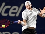USA's John Isner plays a forehand