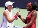 Iga Swiatek (L) congratulates Coco Gauff after their match.