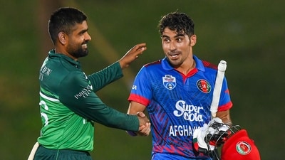 Pakistan's captain Babar Azam (L) congratulates Afghanistan's Rahmanullah Gurbaz as he walks back to the pavilion after his 151 during the 2nd ODI (AFP) Pakistan's captain Babar Azam (L) congratulates Afghanistan's Rahmanullah Gurbaz as he walks back to the pavilion after his 151 during the 2nd ODI (AFP)