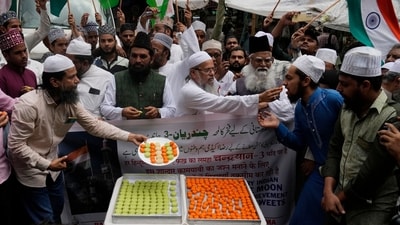 Indians distribute sweets to celebrate the success of Chandrayaan - 3 soft landing on the moon, in Mumbai, India, Wednesday, Aug. 23, 2023.(AP Photo/Rajanish Kakade) (AP) Indians distribute sweets to celebrate the success of Chandrayaan - 3 soft landing on the moon, in Mumbai, India, Wednesday, Aug. 23, 2023.(AP Photo/Rajanish Kakade) (AP)