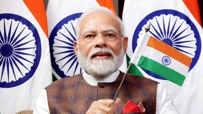 Prime Minister Narendra Modi waves the Indian flag while watching the telecast of Chandrayaan-3's successful soft landing on the Moon (PTI) Prime Minister Narendra Modi waves the Indian flag while watching the telecast of Chandrayaan-3's successful soft landing on the Moon (PTI)