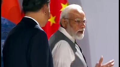Prime Minister Narendra Modi and Chinese President Xi Jinping engage in a brief interaction at the 15th BRICS Summit, in Johannesburg on Thursday (ANI)