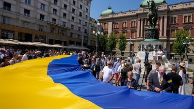 People hold a giant Ukrainian flag during a rally to mark the 32nd anniversary of Ukraine's independence. (AP) People hold a giant Ukrainian flag during a rally to mark the 32nd anniversary of Ukraine's independence. (AP)