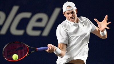 USA's John Isner plays a forehand (AFP) USA's John Isner plays a forehand (AFP)