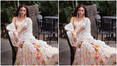 Aditi looked elegant in a white sleeveless blouse featuring mirror work and embroidery details in shades of multiple colours. In a matching long and flowy skirt and an organza dupatta with mirror and embroidery work and zari work at the worders, she completed her look. (Instagram/@aditiraohydari) Aditi looked elegant in a white sleeveless blouse featuring mirror work and embroidery details in shades of multiple colours. In a matching long and flowy skirt and an organza dupatta with mirror and embroidery work and zari work at the worders, she completed her look. (Instagram/@aditiraohydari)