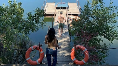 Kylie Jenner is in Italy for the summer. She has bee sharing pictures of herself and her friends from the trip, almost every day, on Instagram. This picture showes her in a green bikini under her blue jeans, making her way to a serene lake, following a friend. Kylie Jenner is in Italy for the summer. She has bee sharing pictures of herself and her friends from the trip, almost every day, on Instagram. This picture showes her in a green bikini under her blue jeans, making her way to a serene lake, following a friend.