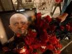 A member of private mercenary group Wagner pays tribute to Yevgeny Prigozhin.