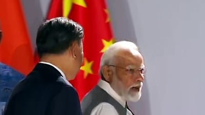 Prime Minister Narendra Modi and Chinese President Xi Jinping engage in a brief interaction at the 15th BRICS Summit, in Johannesburg on Thursday. (ANI)