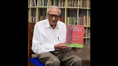 Author Shivdatt Sharma with his book about Pierre Jeanneret’s work at Chandigarh Press Club on Thursday. (Keshav Singh/HT)