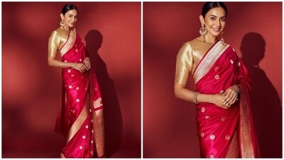 In a recent display of style, Rakul Preet mesmerized her fans with stunning photographs showcasing her in a captivating red Banarasi silk saree. (Instagram/@rakulpreet) In a recent display of style, Rakul Preet mesmerized her fans with stunning photographs showcasing her in a captivating red Banarasi silk saree. (Instagram/@rakulpreet)
