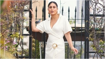 Earlier, Kareena had posted another monotone look on Instagram. She slipped into an all-white ensemble featuring notch lapel collars, a gold buckle, a plunging V neckline, a thigh-high slit on the front, half-length sleeves, and a figure-hugging silhouette. (HT Photo/Varinder Chawla) Earlier, Kareena had posted another monotone look on Instagram. She slipped into an all-white ensemble featuring notch lapel collars, a gold buckle, a plunging V neckline, a thigh-high slit on the front, half-length sleeves, and a figure-hugging silhouette. (HT Photo/Varinder Chawla)