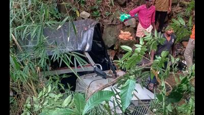 People stand near the mangled remains of a jeep that fell into a gorge, in Wayanad district on Friday. The jeep was descending from the Kannoth hill towards Thalappuza when the driver reportedly lost control . (PTI) People stand near the mangled remains of a jeep that fell into a gorge, in Wayanad district on Friday. The jeep was descending from the Kannoth hill towards Thalappuza when the driver reportedly lost control . (PTI)