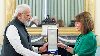 Prime Minister Narendra Modi being conferred with the Grand Cross of the Order of Honour by Greek President Katerina N. Sakellaropoulou, in Athens on Friday. (ANI/PIB)