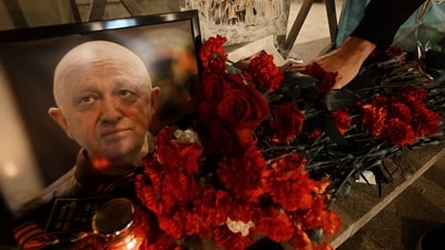 A member of private mercenary group Wagner pays tribute to Yevgeny Prigozhin. (AFP) A member of private mercenary group Wagner pays tribute to Yevgeny Prigozhin. (AFP)