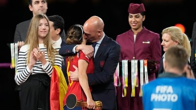 President of Spain's soccer federation, Luis Rubiales, right, hugs Spain's Aitana Bonmati on the podium following Spain's win in the final of Women's World Cup soccer against England at Stadium Australia in Sydney, Australia, Sunday, Aug. 20, 2023. At left is Spain's Princess Infanta Sofia. (AP) President of Spain's soccer federation, Luis Rubiales, right, hugs Spain's Aitana Bonmati on the podium following Spain's win in the final of Women's World Cup soccer against England at Stadium Australia in Sydney, Australia, Sunday, Aug. 20, 2023. At left is Spain's Princess Infanta Sofia. (AP)
