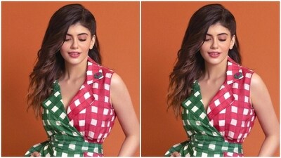 Sanjana looked stunning as ever in the long dress with collars adorning the plunging neckline, featuring checkered prints in shades of pink, green and white. The ankle-length dress came with a matching belt detail at the waist. (Instagram/@sanjanasanghi96) Sanjana looked stunning as ever in the long dress with collars adorning the plunging neckline, featuring checkered prints in shades of pink, green and white. The ankle-length dress came with a matching belt detail at the waist. (Instagram/@sanjanasanghi96)