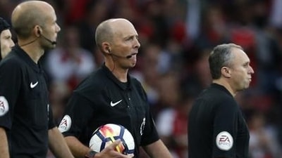 Referee Mike Dean (centre) during a Premier League game (File) Referee Mike Dean (centre) during a Premier League game (File)