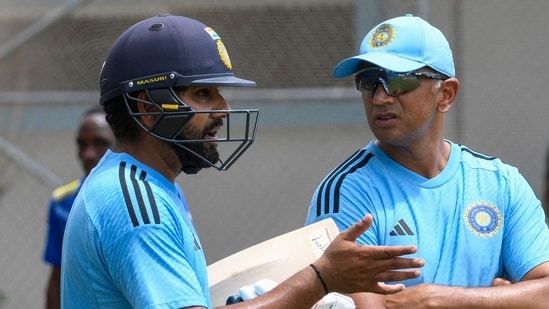 Rohit Sharma (L) and Rahul Dravid (R), of India, take part in a training session ahead of 2023 Asia Cup (AFP)