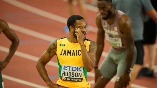 Andrew Hudson, of Jamaica, left, reacts after the finish in the Men's 200-meters semifinal during the World Athletics Championships in Budapest, Hungary (AP)
