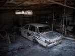 The view of a burned car after a wildfire in the Fyli suburb, northwest Athens, Greece, Friday, Aug. 25. The view of a burned car after a wildfire in the Fyli suburb, northwest Athens, Greece, Friday, Aug. 25.