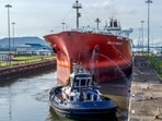 A cargo ship navigates through the Panama Canal in the area of the Cocoli Locks, in Panama City on Agust 25, 2023. The drought-hit Panama Canal will maintain restrictions on the passage of ships for one year, a measure that has already led to a marine traffic jam as boats line up to enter the crucial waterway linking two oceans, an official said late Thursday. A cargo ship navigates through the Panama Canal in the area of the Cocoli Locks, in Panama City on Agust 25, 2023. The drought-hit Panama Canal will maintain restrictions on the passage of ships for one year, a measure that has already led to a marine traffic jam as boats line up to enter the crucial waterway linking two oceans, an official said late Thursday.