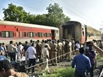 Security personnel and other officials at the spot after a fire broke out in a coach of a train at Madurai railway station, Saturday.