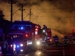 Fire fighters work as flames rise after an explosion at a LPG station in Crevedia, near Bucharest, Romania, on Saturday.