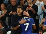 Chelsea's Raheem Sterling with manager Mauricio Pochettino