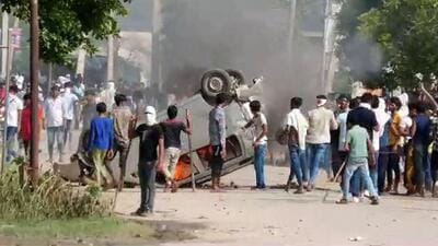 A vehicle being set on fire by miscreants after clashes broke out during a religious procession in Nuh on July 31. Six people had died in the flare-up that had spread to neighbouring Gurugram district. (HT file photo)