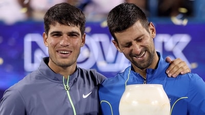 Carlos Alcaraz of Spain and Novak Djokovic of Serbia pose with their trophies after the final of the Western & Southern Open at Lindner Family Tennis Center (Getty Images via AFP) Carlos Alcaraz of Spain and Novak Djokovic of Serbia pose with their trophies after the final of the Western & Southern Open at Lindner Family Tennis Center (Getty Images via AFP)