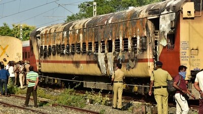 Madurai: Security personnel at the spot after a fire broke out in a coach of a train at Madurai railway station, Saturday, Aug. 26, 2023. At least 8 people were killed, according to officials. (PTI Photo)(PTI08_26_2023_000001A) (PTI) Madurai: Security personnel at the spot after a fire broke out in a coach of a train at Madurai railway station, Saturday, Aug. 26, 2023. At least 8 people were killed, according to officials. (PTI Photo)(PTI08_26_2023_000001A) (PTI)