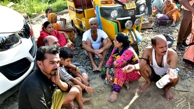 Passengers wait outside after a fire broke out in a coach of a train at Madurai railway station. (PTI) Passengers wait outside after a fire broke out in a coach of a train at Madurai railway station. (PTI)