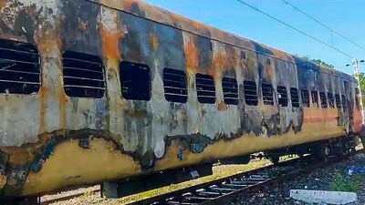 Remains of a train's coach that caught fire at Madurai railway station. (PTI) Remains of a train's coach that caught fire at Madurai railway station. (PTI)