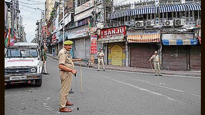 Police personnel stand guard during the Jammu bandh in protest over Sarore toll plaza collection and smart meters on Saturday. (ANI) Police personnel stand guard during the Jammu bandh in protest over Sarore toll plaza collection and smart meters on Saturday. (ANI)